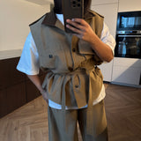 Veste sans manche à ceinture