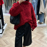 Pull en maille rouge